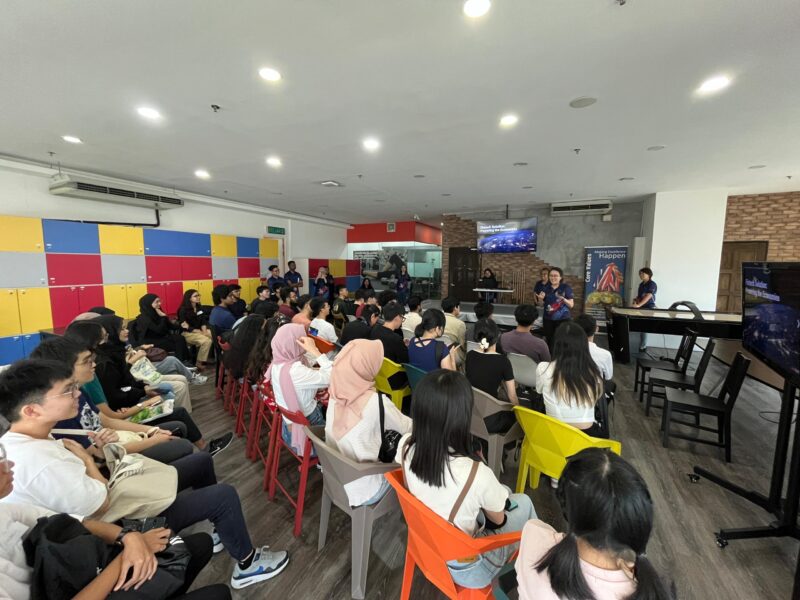 Universiti Malaya students listening attentively to Elizabeth at the start of the Industrial visit